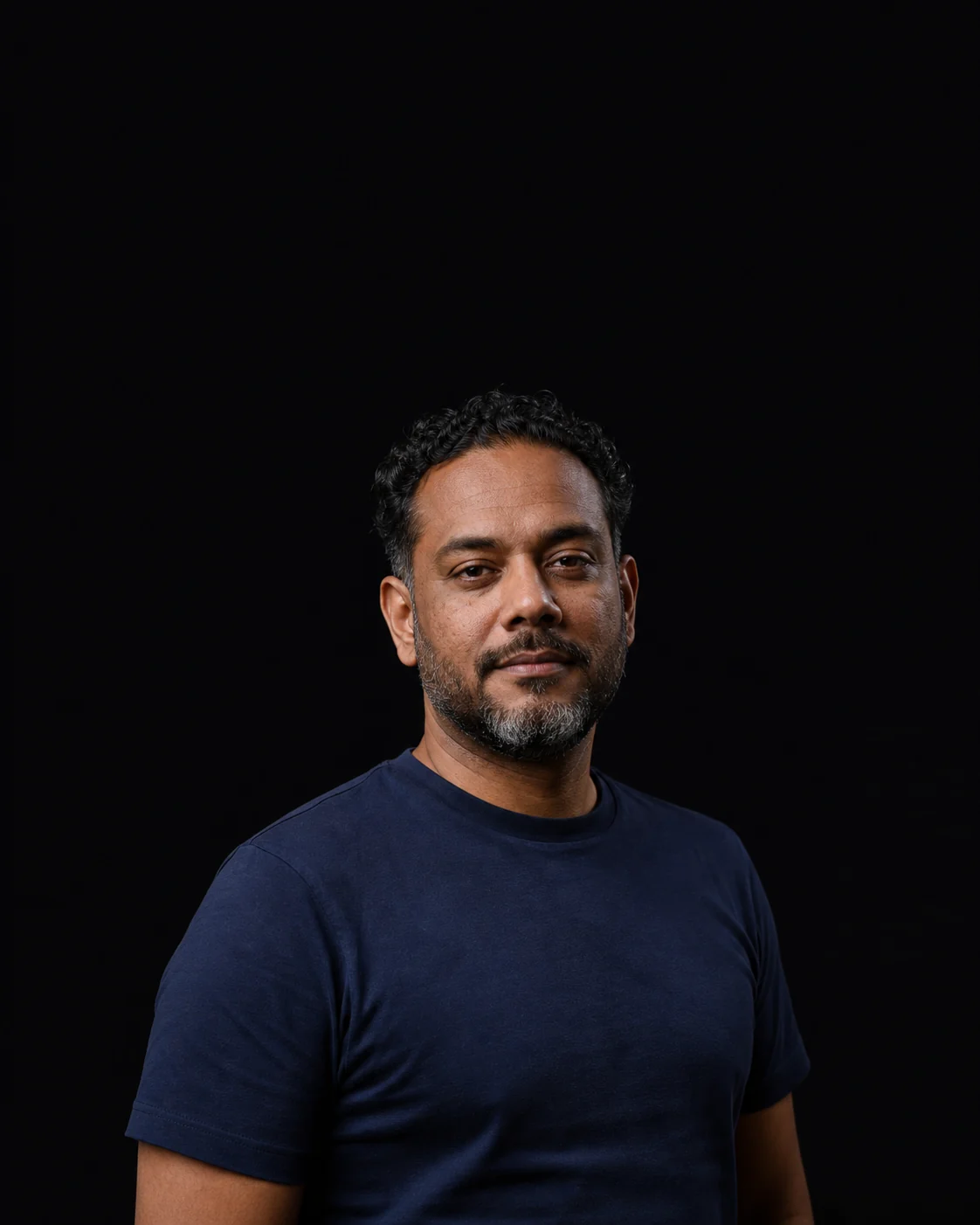 DueHello support team member in a dark studio portrait